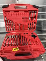 Open Craftsman case showing various drill, driver and spade bits in molded trays