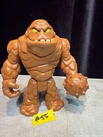 Front view showing overall appearance, facial details, spiked mace, and height reference