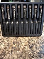 Front view of ten Langmanni eyeshadow sticks in plastic tray