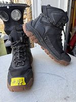 Side view of both boots showing uppers, lacing, ankle padding