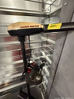 Full view of Minn Kota trolling motor mounted in storage unit