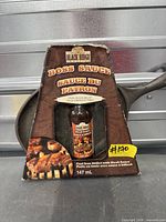 Boxed set showing skillet and sauce bottle