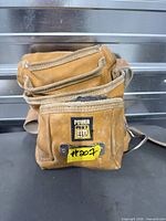 Front view of Power Fist leather tool belt showing logo patch