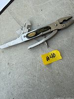 Front view showing Sheffield logo, pliers, saw blade and other implements