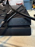 Front left corner of PS4 showing PS4 logo
