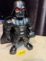 Front view of Darth Vader figure standing upright