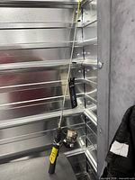 Full view of Sub Zero ice fishing rod and reel in storage bay