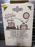 Front of boxed Vintner's Deluxe Complete Starter Kit showing branding and 17-piece contents list