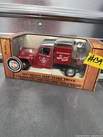 Box front showing red 1953 Willys Jeep stake truck with Canadian Tire branding in clear window