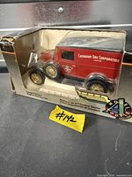 Front view of boxed red Canadian Tire 70th Anniversary Ford die-cast truck