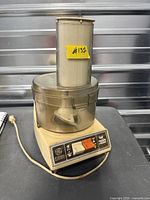 Overall view showing GE food processor base, bowl, lid, feed chute and power cord