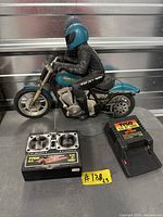 RC motorcycle, transmitter, charger grouped