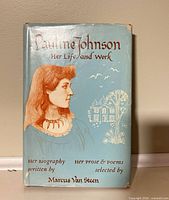 Front view of book with dust jacket showing title and portrait