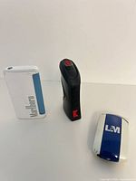 Three lighters standing upright showing branding and overall form