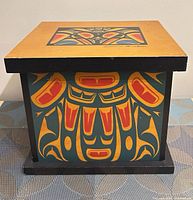 front view of painted wooden box with lid