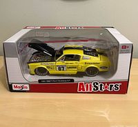 Front view of boxed 1:24 scale 1967 Ford Mustang GT model