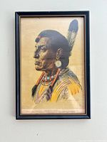 Full view of framed portrait print on wall