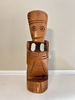 Front view of carved wooden figure