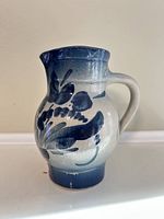 Front view showing blue floral design and handle