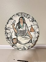 Front view of round plaque showing full design and colors