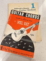 Cover view of both instructional guitar books