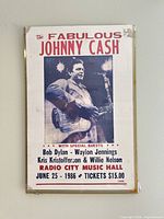 Frontal view of framed Johnny Cash concert poster showing full text and image