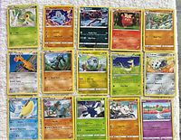 All 15 Pokémon cards laid out in three rows