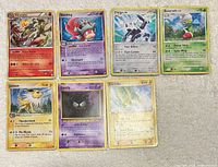Front view of all seven Pokémon cards