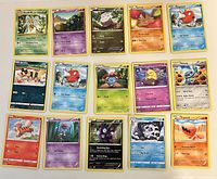 Full set of 15 Pokémon cards laid out