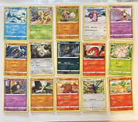 Front view of all 15 Pokémon cards laid out in three rows