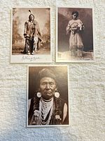All three postcard-size prints displayed on textured surface