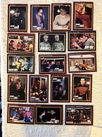 All 17 cards laid out in four rows on light fabric