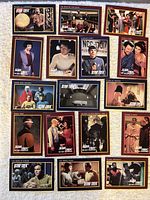 All 17 trading cards laid out; clear view of fronts and titles