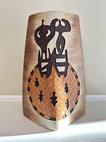 Front view of ceramic vase showing complete decorative motif