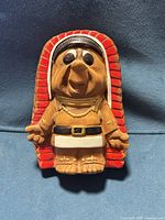 Front view of ceramic chief coin bank