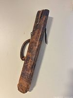 Full view of leather surveyor’s case showing length, handle and flap