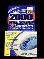 Front of sealed 2000 Flushes Blue plus Detergents package showing branding and weight