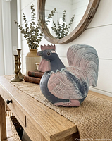 rooster sculpture on console table, shows side profile and paint finish