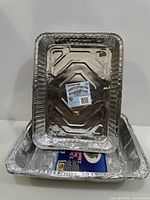 Top view showing two nested aluminum foil pans with product label