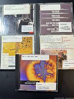 Front view showing all five CD fronts with library stickers