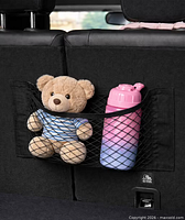 Net installed in car holding bottle and toy (demonstration, contents not included)