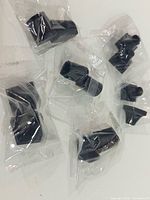 Group of individually bagged black rubber leg tips