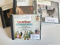 Front covers of three CDs including Show Boat, David Sanborn and Bix Beiderbecke with library labels visible