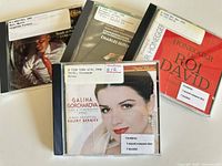 Front covers of the four CDs with library labels visible