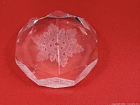 Top view showing etched snowflake and chip on rim