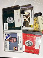 All five CDs spread out showing covers and library stickers