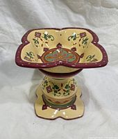 Top view showing square-rim bowl and floral motif