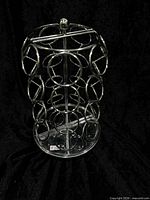 Full view of chrome K-Cup carousel on black backdrop