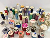 Front and top views of multiple spools in assorted colors and brands