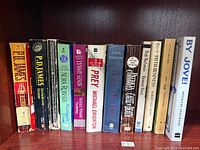 Row of all books showing spines and titles